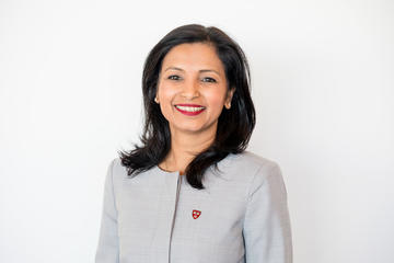 Smitha Haneef smiling at camera