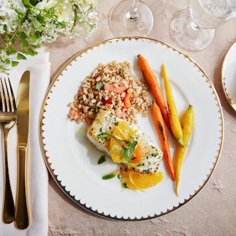 overhead view of plated catering dinner on gold rimmed plate