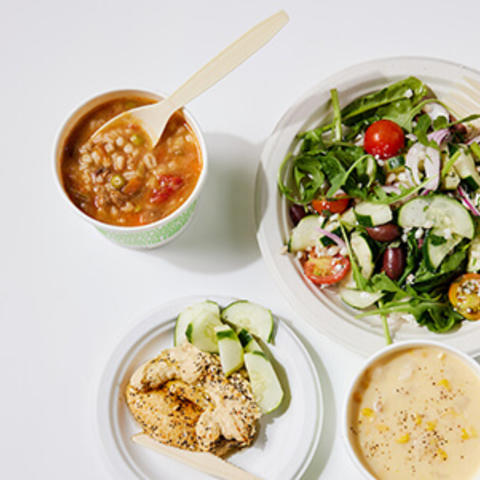 cup of soup, salad and hummus plate