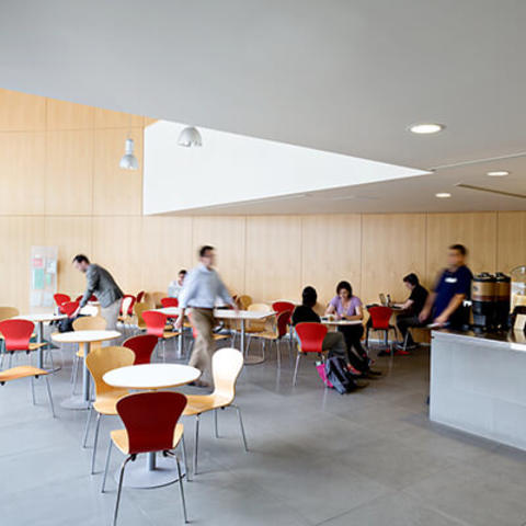 interior shot of cafe with students seated at tables