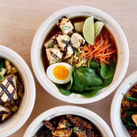 overhead of different bowls including ramen bowl and grilled tofu bowl