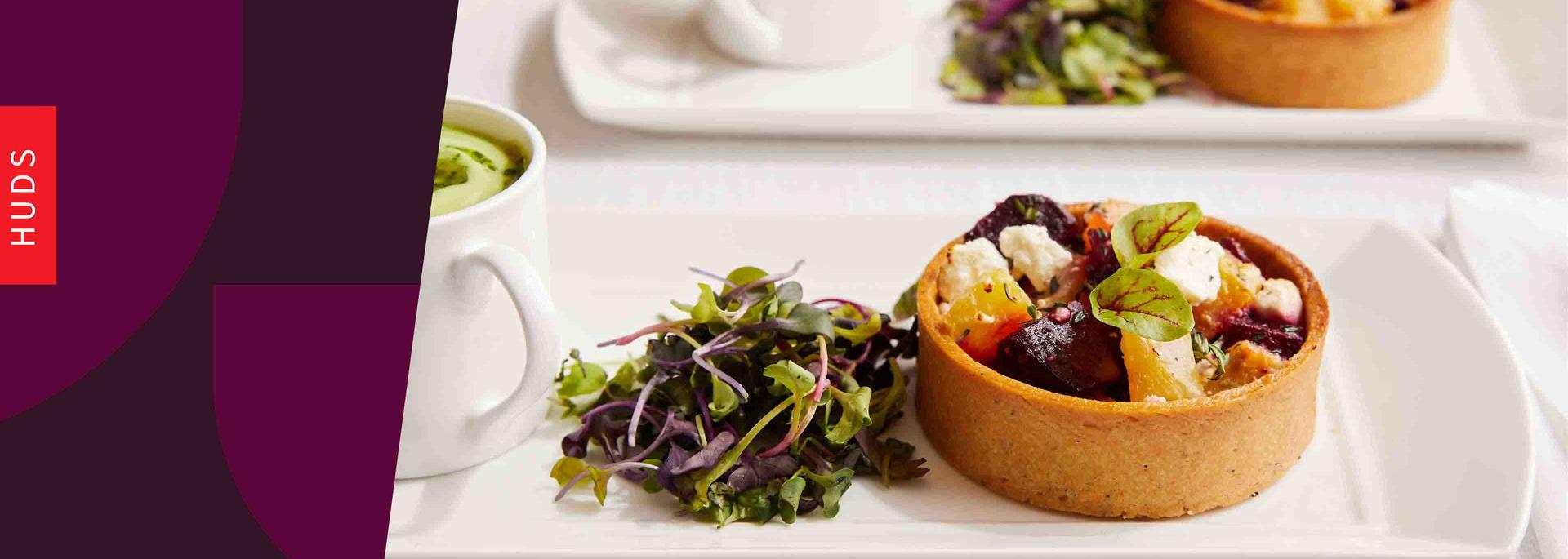 plated beet tart with microgreens salad